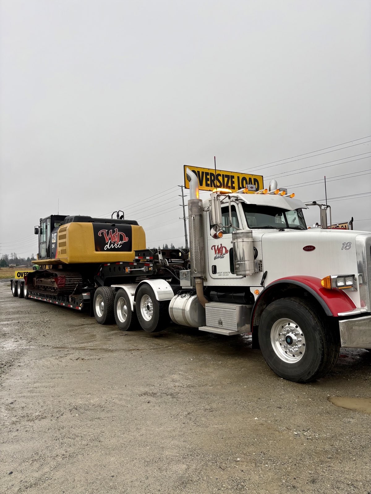 WD Dirt Peterbilt with oversize load excavator transport